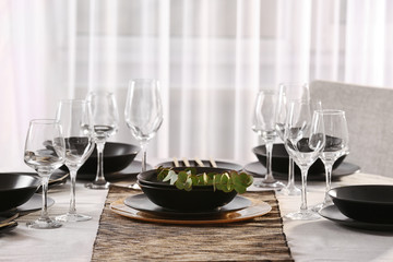 Table with beautiful setting in restaurant, closeup