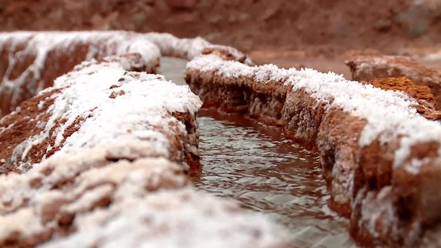 PERU: Salt evaporation pond in Maras (Close-up). HD Video footage from the Andes of Peru, South America