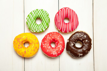 Doughnuts on a white wooden table