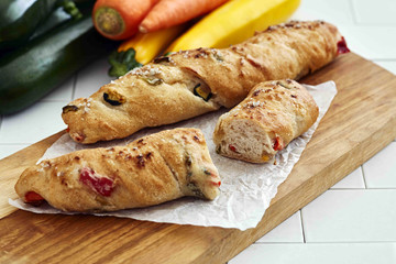 Fresh loaf of bread on wooden table