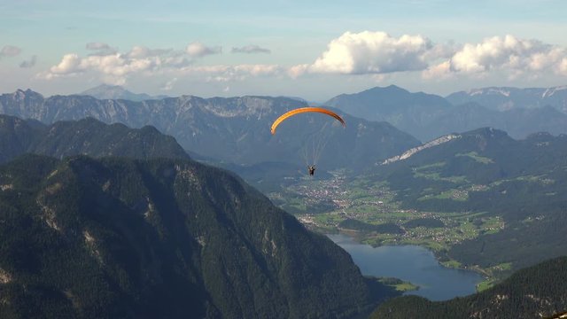 Skydiver or Paraglider over Austrian Alps Mountains. 4K 