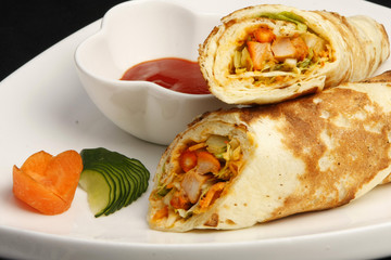 Mexican tacos with chili sauce on white dish