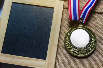 Blank copy space backround on small green board with coin or medal prize