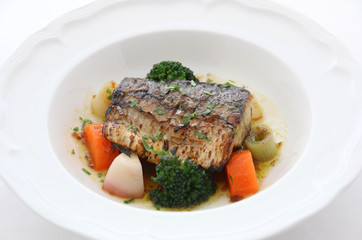 Sauteed tuna with onion and carrots on white platters