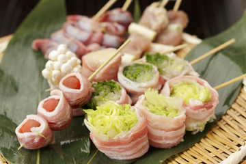 Skewers of pork and lettuce