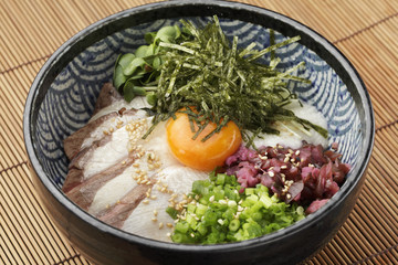 Bowl of ramen udon noodle with eeg, onion, pork and sprouts