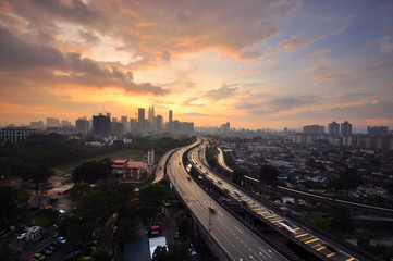 Fototapeta na wymiar Dramatic sunset view over the Kuala Lumpur city sky crappers.
