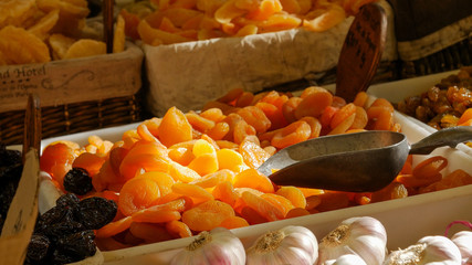 Dried apricot fruit on heap at marketplace. Close up.