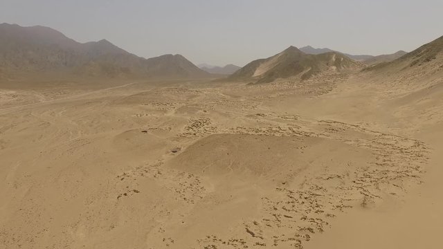 Aerial of a desert with dunes in Peru, South America.  Aerial near the city of Caral