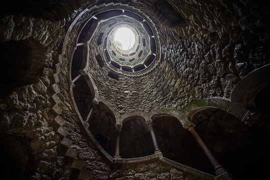 The Initiation well of Quinta da Regaleira in Sintra. The depth of the well is 27 meters. It connects with other tunnels through underground passages. Sintra. Portugal