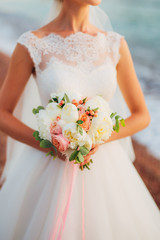 Wedding bouquet in hands of the bride. Wedding in Montenegro