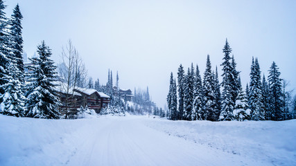 Snow covered houses and streets in a neighborhood of  the alpine village of Sun Peaks in the Shuswap Highlands of central British Columbia, Canada
