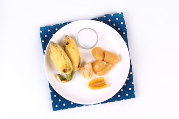 Boiled banana in syrup and wholes of banana.