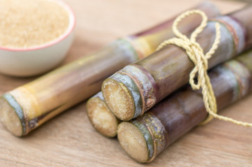 Close up sugarcane,Sugar cane on wood background.Close up Sugar cane on wood background.