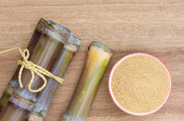 Close up sugarcane,Sugar cane on wood background.Close up Sugar cane on wood background.