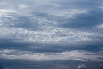 Naklejka na ściany i meble Dramatic sky with stormy clouds before rain and thunderstorm