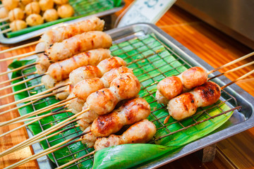 East sausage being grilled, Thai food style.