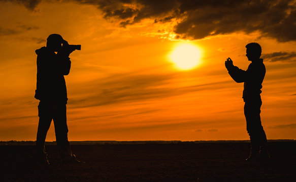 Nature photographer silhouette the sunset