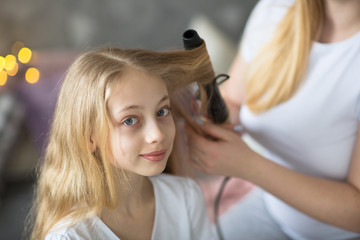 Naklejka premium beautiful mother curls hair daughter teen