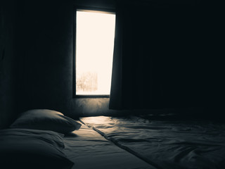 Dark bedroom and window light.