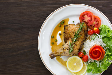 Grilled Chicken steak with black pepper In white dish on the wooden table