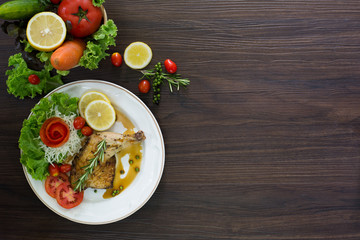 Grilled Chicken steak with black pepper In white dish and vegetables in the basket On the wooden table