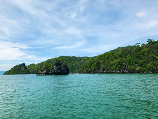 Obraz premium Island under sun shine beautiful emerald sea and blue sky in summer of Andaman sea Trang province Thailand