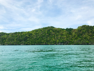 Island  under sun shine beautiful emerald sea and blue sky in summer of Andaman sea Trang province Thailand