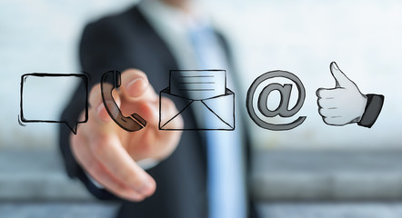 Businessman touching manuscript contact icon with his finger