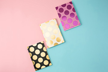 The three notebooks on colorful baground