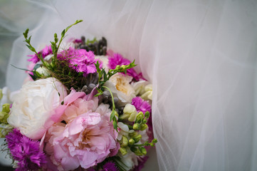 Wedding bouquet with wedding dress background