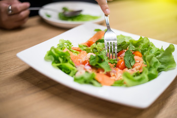 Salmon Salad is on a plate placed