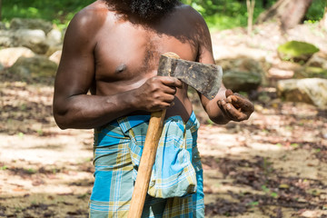 Vedda man holds axe