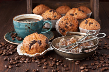 Homemade muffins with black coffee and brown sugar