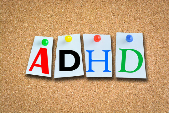 Attention Deficit Hyperactivity Disorder concept with ADHD text on cork billboard
