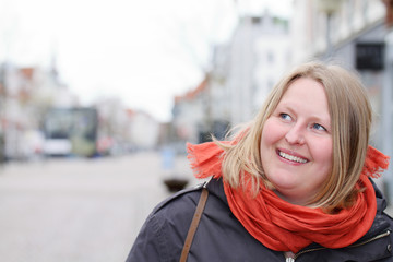 Scandinavian woman looking at copyspace in town