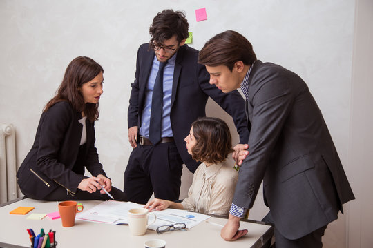 Group of coworkers discussing business issues