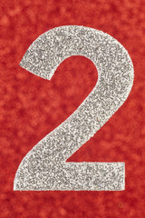 Number two silver color over a red background. Anniversary.