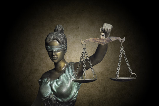 Lady Justice on grunge brown background