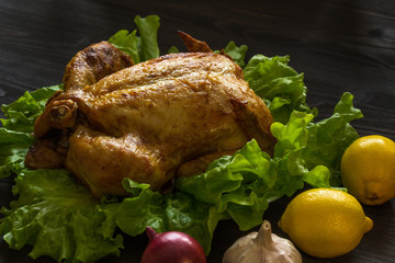 baked chicken on lettuce leaves