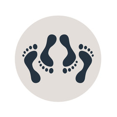 Icono plano pies simbolizando sexo en circulo gris