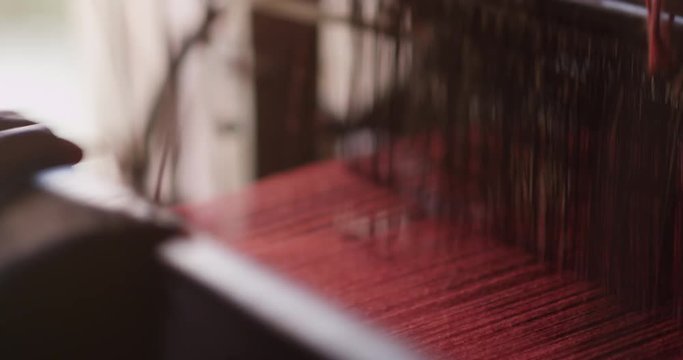 Nepali women makes a Pashmina Shawl the traditional way in Bhaktapur, Nepal
