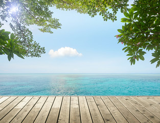 Beauty tropical seascape on background blue cloud sky. View from wood pier