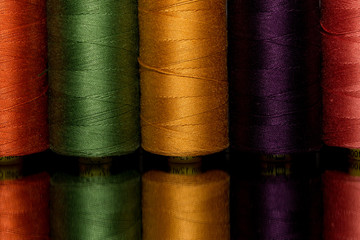 colorful spools of sewing thread
