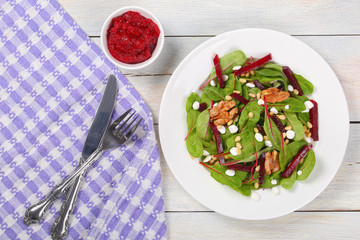 caramelized walnuts salad on white plate