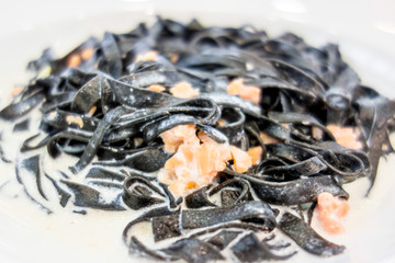 tasty pasta with salmon on a the table