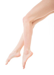 Beautiful shaved female legs and feet. Isolated on white. Beautiful female legs after depilation. Healthcare, foot care, rutine treatment. Spa and epilation. 