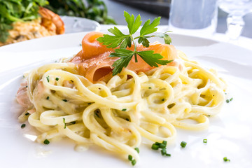 tasty pasta with salmon on a the table