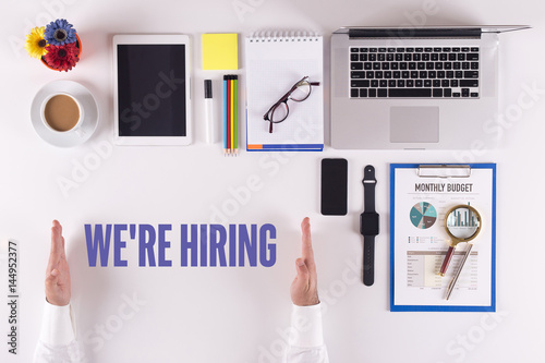 Businessman Working On Desk Hands Showing We Re Hiring Concept