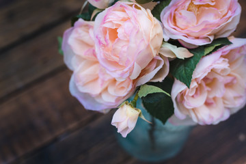 Beautiful bouquet of roses in a vase. Selective focus. Place for text. 